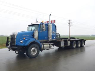 2006 Western Star 4900SA Texas Bed Winch Tractor, Detroit Diesel 60-14, 515 HP, Showing 863.276 KM, Showing 14375 HRS, 18 Speed  Eaton  Fuller, Triple Diff Lock, Tires Front 446/65R22.5 95%, Rears 11R24.5 65%,  Sliding 5th Wheel, 34" Sleeper, Tulsa 30 Ton Hyd. Winch, Air Ride Cab, Alum Wheels, Double Frame, Live Roll, Aux Hydraulics, LED Lighting, C/w Spare Belts, Filters (4), Slings, Tire Chains, Storage Cabinet, Beacons, CVIC Expires  06/21, VIN 5KKPALCK06PV64630
