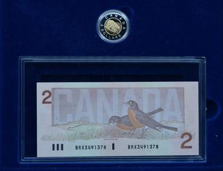 Canada Two Dollar Bank Note And Two Dollar Uncirculated Coin In Display Case.