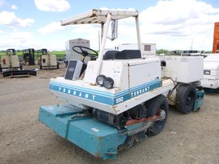 Tennant 550 Electric Floor Sweeper C/w Nexen 25amp Professional Battery Charger. Showing 3815hrs. SN 5504300 *Note: Side Mirror Broken, Running Condition Unknown*