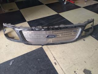 USED F 150 FRONT GRILL ASSEMBLY WITH STAINLESS INSERT, Part #N/A.