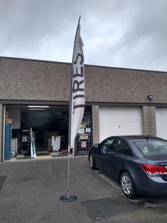 Advertising Flag Pole With Black Metal Base.