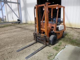 1983 Toyota Forklift c/w 3 Stage Mast, 42" Standard Forks, Showing 989.1 Hours, 3500 LB Capacity, PNEU w/ Independent Fork Shift, 21X8-9 Front Tires, 5.70/5.00-8NHS Rear Tires, SN 13928 *NOTE: Information As Per Owner, No Carriage/Backrest, Missing Data Plate*