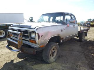 1990 Dodge Ram 1500 L3 4X4 Super Cab Flat Deck Truck C/w A/T, A/C, GVWR 2,903KG, 8'5" x 7' Deck, Kelsey Brake Control System, Steel Bumper Grizzly, 31x10.50R15 Tires At 10%, 1,633KG Axle Rating, Showing 321,315 KMS. VIN 3B7HM13Z5LM045699 *NOTE: Oil Leak (Engine) Driver Door Hinges Need Replacing, Missing Rear Seats*
