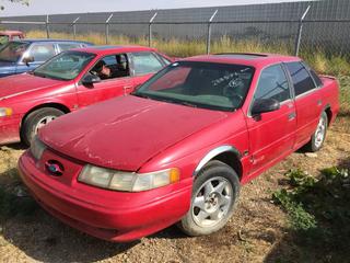 Selling Off-Site - 527 North 200 East, Raymond, AB -  1994 Ford Taurus SHO 4 Door c/w Auto Trans, Showing 288,572. No Keys, Parts Only. S/N 1FALP54P1PA154028