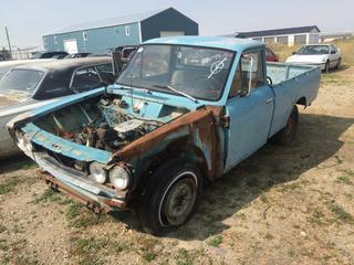 Selling Off-Site - 527 North 200 East, Raymond, AB -  1970 Datsun Truck c/w Manual Trans, S/N L-S21-144978  
