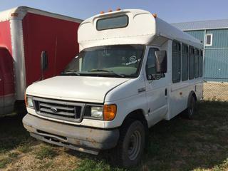 Selling Off-Site - 527 North 200 East, Raymond, AB -  2006 Ford E-350 Handi Bus cw/ V8, Auto. Showing 400,967 kms. S/N 1FDSE35L06DA98877.