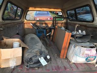 Selling Off-Site - 527 North 200 East, Raymond, AB -  Contents of Red/White Box Trailer. Includes Punching Bag, Car Parts, Wood Paddle, Plumbing Part, Etc.