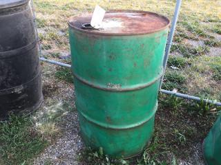 Selling Off-Site - 527 North 200 East, Raymond, AB -  Green 45 Gal. Drum.