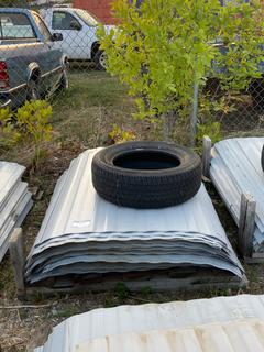 Selling Off-Site - 527 North 200 East, Raymond, AB -  Pallet of Metal Siding. 85 Sheets.
