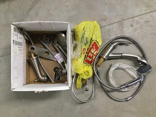 Box of Showerheads & Kitchen Faucet.