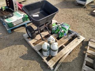 Grass Seed, Seed Spreader & Jugs of Concrete Surfacer.