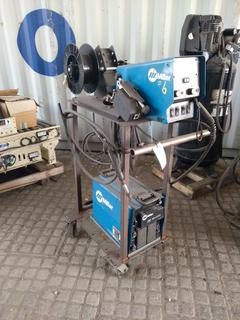 Miller XMT Welder & Miller 70 Series 24V Wire Feeder with Cables on Cart.