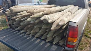 Selling Off-Site - 527 North 200 East, Raymond, AB -  Approximately 40 Fence Posts.