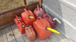 Selling Off-Site - 527 North 200 East, Raymond, AB -  (7) Assorted Plastic Gas Cans.