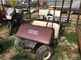 Selling Off-Site - 527 North 200 East, Raymond, AB -  EZ Go Electric Golf Car.