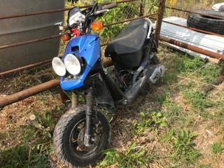 Selling Off-Site - 527 North 200 East, Raymond, AB -  Blue Yamaha Scooter. (Parts).
