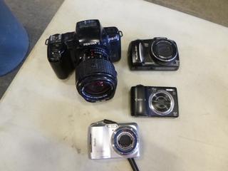 (1) Pentax Digital Camera, (2) Cannon Digital Cameras, (1) Kodak Digital Camera (C1)