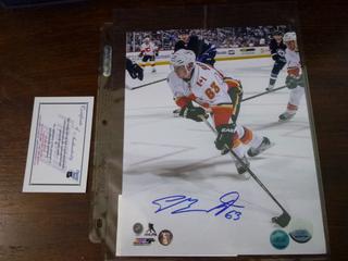 Sam Bennett Autographed 8" x 10" Calgary Flames Picture. C.O.A.  From Frozen Pond.  Inscribed "63"
