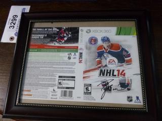 EA Sports NHL 14 Exclusive Taylor Hall Edmonton Oilers Cover.  Signed by Taylor Hall.  No C.O.A., C/w Frame