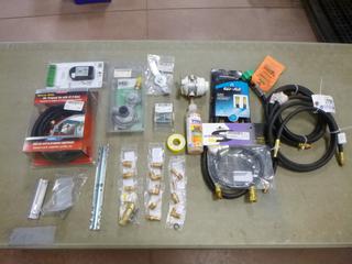 Qty Of Assorted Propane Related Parts Includes: LPG Double Tank Sensors, 2 3/8in LP Hoses, 1 1/4in LP RVQ Quick Connect Hose, Propane Tee w/ 12ft Hose And Assorted Fittings, Couplers And Regulators