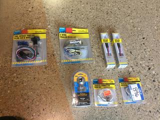 (2) Trailer Wiring Harnesses, (1) Hitch Ball, & (2) Pocket Voltage Testers.