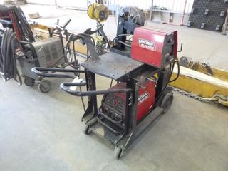 Lincoln Electric Invertec 350 Pro Phase 1 and 3 Welder S/N U1100805036 w/ Cart and Wire Feeder. 