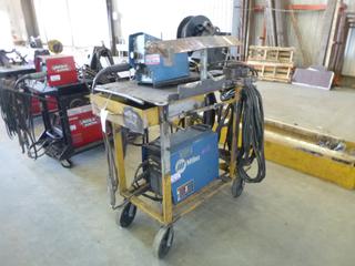 Miller XMT 350 Welder w/ Contents, Cables, Cart, and Wire Feeder. 