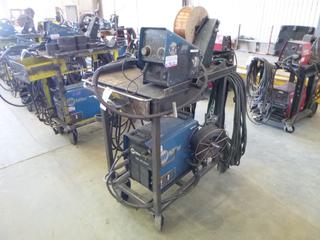 Miller XMT 350 Phase 1 and 3 Welder S/N MC01164A w/ Contents, Cables, Cart, and Wire Feeder. 