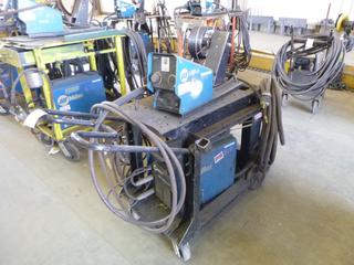 Miller XMT 350 Phase 1 and 3 Welder S/N LE219459 w/ Contents, Cables, Cart, and Cables. 