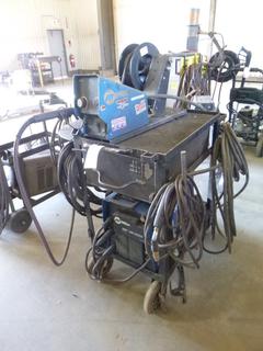 Miller XMT 350 Phase 1 and 3 Welder  S/N ME170586U w/ Contents, Cables, Cart, and Wire Feeder. 