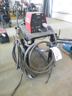 Lincoln Electric Wire Feeder S/N U1110707031 w/ Cart, Cables, and Contents. 