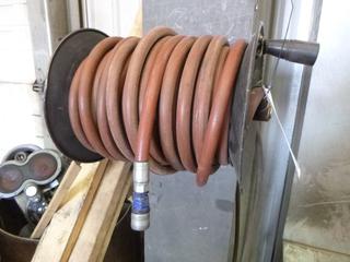 Hose Reel and 100ft 3/8" High Pressure Air Hose. Buyer Responsible for Removal. 