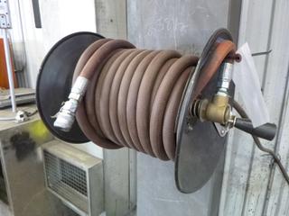 Hose Reel and 100ft 3/8" High Pressure Air Hose. Buyer Responsible for Removal. 