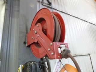 Auto Hose Reel and 50ft Hose w/ Automatic Roll Back. Buyer Responsible for Removal. 