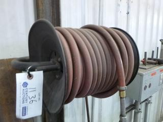 Reel and High Pressure 100ft 3/8" Air Hose. Buyer Responsible for Removal. 