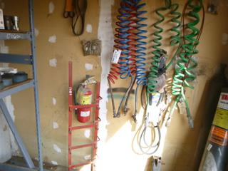 Hose Rack, Air Hoses, and Rubber Belts. 