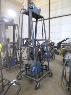 Miller XMT 350 Phase 1 and 3 Welder S/N MD020061U w/ Tall Cart and Wire Feeder. 