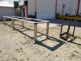 Metal stands/racks. (1) Stainless stee approx. 240" x 44" x 39". (1) Steel approx. 49" x 25" x 32"
