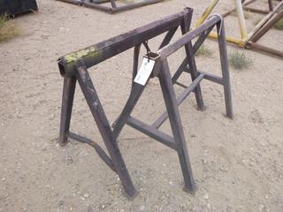 (2) Metal sawhorses. (1) approx 50" x 32" x 35". (1) 40" x 32" x 35"