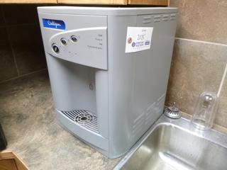 Culligan UV water dispenser. Model: F-2100-M-HC-TT-GR-CUS. Plumbed into wall. Customer responsible for removal.