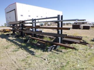 Heavy duty dual sided metal rack w/ contents. I-beams, pipes, tubes. (rack) approx 360" x 84" x 82". (I-beam) up to 480" long. Buyer responsible for removal