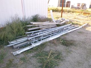 Qty of misc metal. Partial framing for tarp building. Channeling/straps/spikes. Buyer responsible for removal