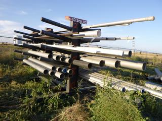 2-sided metal rack w/ contents. (rack) approx 144" x 72" x 84". Various sizes of pipe/bars. Buyer responsible for removal