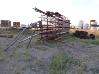 Steel rack w/ contents. (rack) approx 222" x 98" x 105". Various sizes metal plates/bars. Buyer responsible for removal