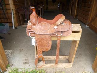 Vic Bennett Trophy Roping Saddle C/w Engraving on saddle consists of Fender Both Sides; Canadian Champion Open Horse, Brand On Both Sides Of The Seat 2D Over Half Diamond, On Skirth Behind Seat CCHA 1978. 