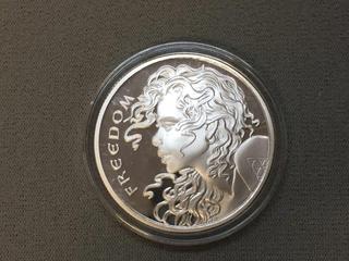 2014 Silver Shield One Troy Ounce .999 Pure Silver Coin.