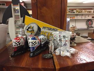 Assorted Hockey Collectables including Goalie Heads, Fleury Bobble Head, Mini Cups, Stanley Cups Ect.