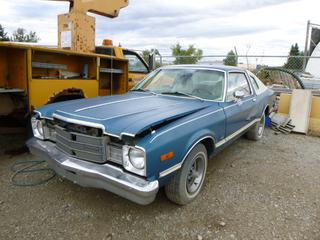1976 Plymouth Volare Coupe C/w 360 Cu in, A/T, Edelbrock Carb And Intake And Hedman Headers. Showing 9790 Mi. VIN HP29K6B273201 *Note: Engine Turns Over, Running Condition Unknown, Buyer Responsible For Load Out*