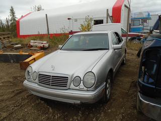 1999 Mercedes E320 4-Door Car C/w 3.2 L, 6-Cyl A/T, Leather, Sunroof. VIN WDBJF65H6XA754446 *Note: Parts Only, Back Windows Broken, Hood Latch Damaged, Interior Damaged, Buyer Responsible For Load Out*