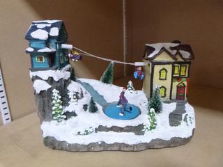 Battery Operated Christmas Skating Village Ornament *Note: Working Condition Unknown, **Note: Buyer Responsible For Load Out, Located Offsite For More Info Contact Shazeeda @780-721-4178***
